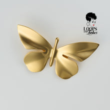 Load image into Gallery viewer, Gold butterfly-shaped Ascend Brooch with high-shine PVD plating, captured in a flat lay on a neutral background. Statement accessory symbolizing transformation and elegance.