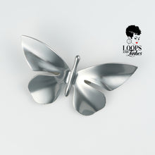 Load image into Gallery viewer, Silver butterfly-shaped Ascend Brooch made of stainless steel, captured in a flat lay on a neutral background. Statement accessory symbolizing transformation and elegance.