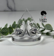 Load image into Gallery viewer, Clear Cascades are elegant earrings resembling cascading water droplets, crafted with transparent resin. Their sleek design adds a touch of sophistication to any outfit, providing a subtle yet striking accessory for all occasions.