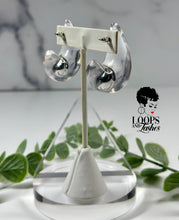 Load image into Gallery viewer, Clear Cascades are elegant earrings resembling cascading water droplets, crafted with transparent resin. Their sleek design adds a touch of sophistication to any outfit, providing a subtle yet striking accessory for all occasions.