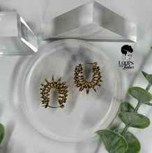 Load image into Gallery viewer, Discover the elegance and innovation of these stainless steel small hoops, featuring intricate winding designs. Elevate your style with these standout fashion pieces that blend uniqueness with sophistication. Shop now to embrace a touch of artistic finesse in your attire.