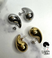 Load image into Gallery viewer, Explore Echo Drop Earrings – a chic blend of modern style and timeless allure. Crafted from stainless steel, chunky water drop studs in gold and silver. Comfortable, hypoallergenic design. Perfect for special events or everyday elegance. Make a statement with these captivating earrings