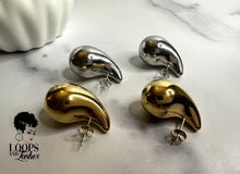Load image into Gallery viewer, Explore Echo Drop Earrings – a chic blend of modern style and timeless allure. Crafted from stainless steel, chunky water drop studs in gold and silver. Comfortable, hypoallergenic design. Perfect for special events or everyday elegance. Make a statement with these captivating earrings