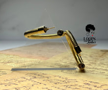 Load image into Gallery viewer, Heritage Hoops displayed against a clean background, showcasing their two-inch open hoop design with a unique textured finish. Made from stainless steel with durable PVD gold plating, these waterproof, tarnish-resistant earrings feature an exclusive engraved submark logo, blending timeless elegance with modern craftsmanship.