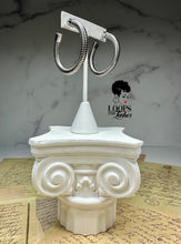 Load image into Gallery viewer, A pair of Heritage Hoops in sleek silver, crafted from high-quality stainless steel with a durable PVD plating. These two-inch open hoop earrings feature a unique textured design and an exclusive engraved submark logo, symbolizing timeless elegance and empowerment. Waterproof and tarnish-resistant, they blend modern sophistication with lasting quality.