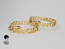 Load image into Gallery viewer, These custom earrings are truly for the unapologetically bold. These hoops earrings are stainless-steel and feature an openwork design with "UNAPOLOGETIC" lettering.