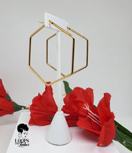 Load image into Gallery viewer, These contemporary gold hoop earrings feature a trendy hexagonal shape for a twist on a classic look.