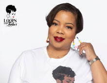 Load image into Gallery viewer, The picture is of a woman wearing a pair of lightweight earrings made in a classic bamboo style. The earrings are decorated with a colorful enamel finish, featuring shades of blue, orange, yellow, red and pink. The earrings have a trapezoidal shape and a gold-toned metal stem that goes through the earlobe.