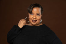 Load image into Gallery viewer, Large and thick silver hoop earrings on attractive woman