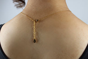 Clasp of gold-plated stainless-steel necklace with four butterfly pendants, symbolizing courage, growth, confidence, and freedom — body-positive statement jewelry.