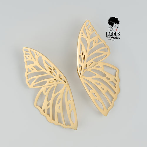 Gold Fearless Wings earrings with intricate wing-inspired design, symbolizing empowerment and transformation, lightweight statement jewelry for bold, confident women