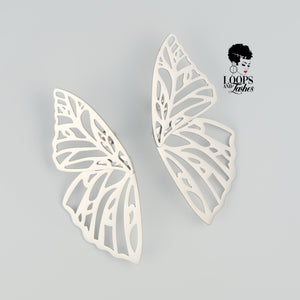 Silver Fearless Wings earrings with intricate wing-inspired design, symbolizing empowerment and transformation, lightweight statement jewelry for bold, confident women