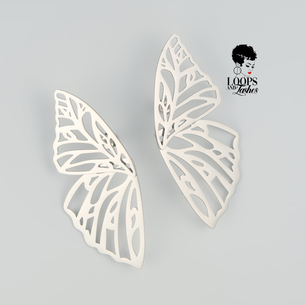 Silver Fearless Wings earrings with intricate wing-inspired design, symbolizing empowerment and transformation, lightweight statement jewelry for bold, confident women