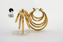 Load image into Gallery viewer, PVD gold-plated stainless steel QuintEssential Loops earrings. Modern, geometric design creates a five-hoop illusion. Stylish statement earrings for pierced ears. 1.61&quot;L x 1.38&quot;W, 29g.
