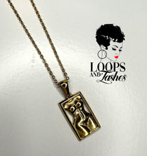 Load image into Gallery viewer, A stunning stainless steel PVD gold plated necklace with a pendant representing body positivity. The pendant showcases a women&#39;s body in a frame, symbolizing self-love and acceptance. Crafted with high-quality materials, this necklace promotes body positivity and empowers women to embrace their bodies
