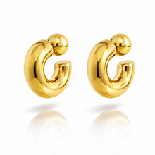 Load image into Gallery viewer, Gold hoop earrings on a white background
