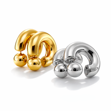 Load image into Gallery viewer, Gold and silver hoop earrings on a white background
