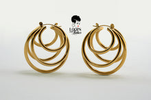 Load image into Gallery viewer, PVD gold-plated stainless steel QuintEssential Loops earrings. Modern, geometric design creates a five-hoop illusion. Stylish statement earrings for pierced ears. 1.61&quot;L x 1.38&quot;W, 29g.

