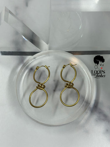 Discover the allure of these captivating infinity sign-shaped hoops featuring intricate winding at the center. Elevate your style with these unique statement pieces that embody timeless elegance. Suitable for all occasions, these earrings are a symbol of everlasting grace.