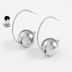 Silver hoop earrings with spherical ball on a white background, featuring the brand 'Loops of Lashes'.